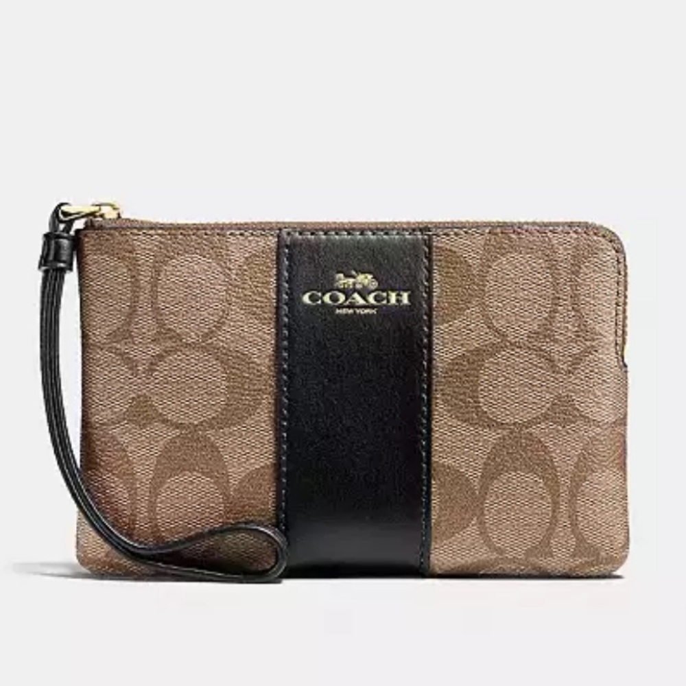 Coach CORNER ZIP WRISTLET IN SIGNATURE CANVAS
new in packaging